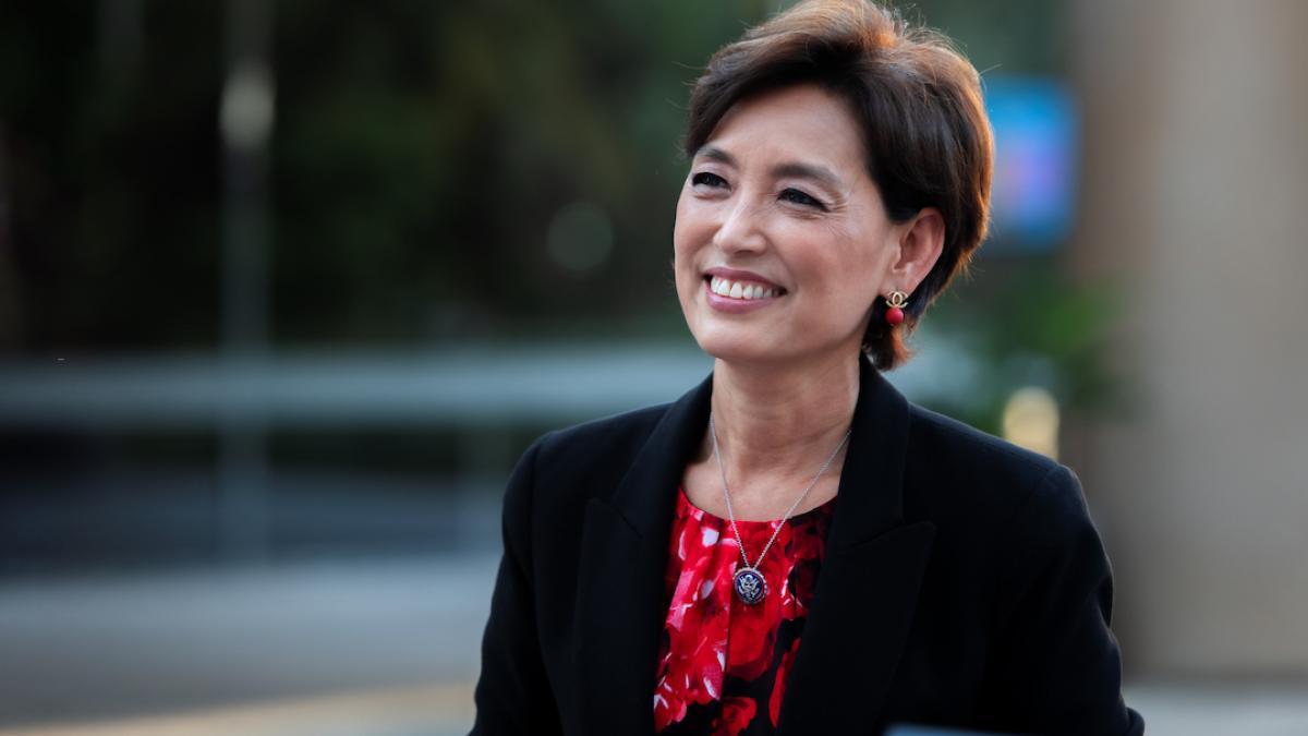 Congresswoman Young Kim Smiling in a Red top and Black Blazer