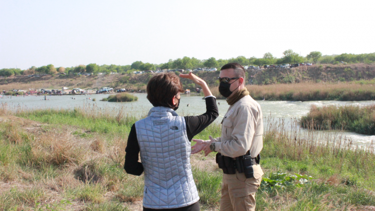 Rep. Young Kim at the Rio Grande River with Border Patrol officer.